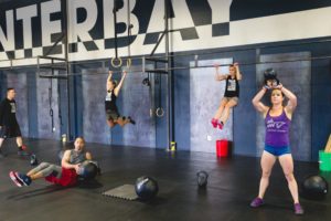 NWCrossfit class students doing various workouts for upper body