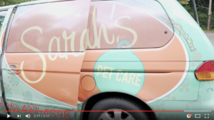 Screenshot from a YouTube video of Sarah's pet care wrapped van