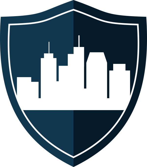 Icon of a shield with a skyline of buildings in it