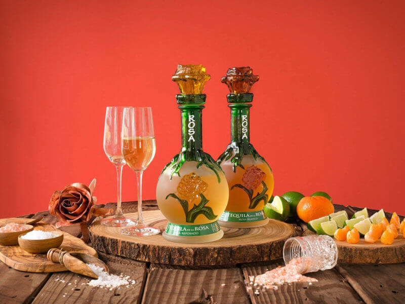 Baston de Rey tequila bottles displayed with salt and wine glasses