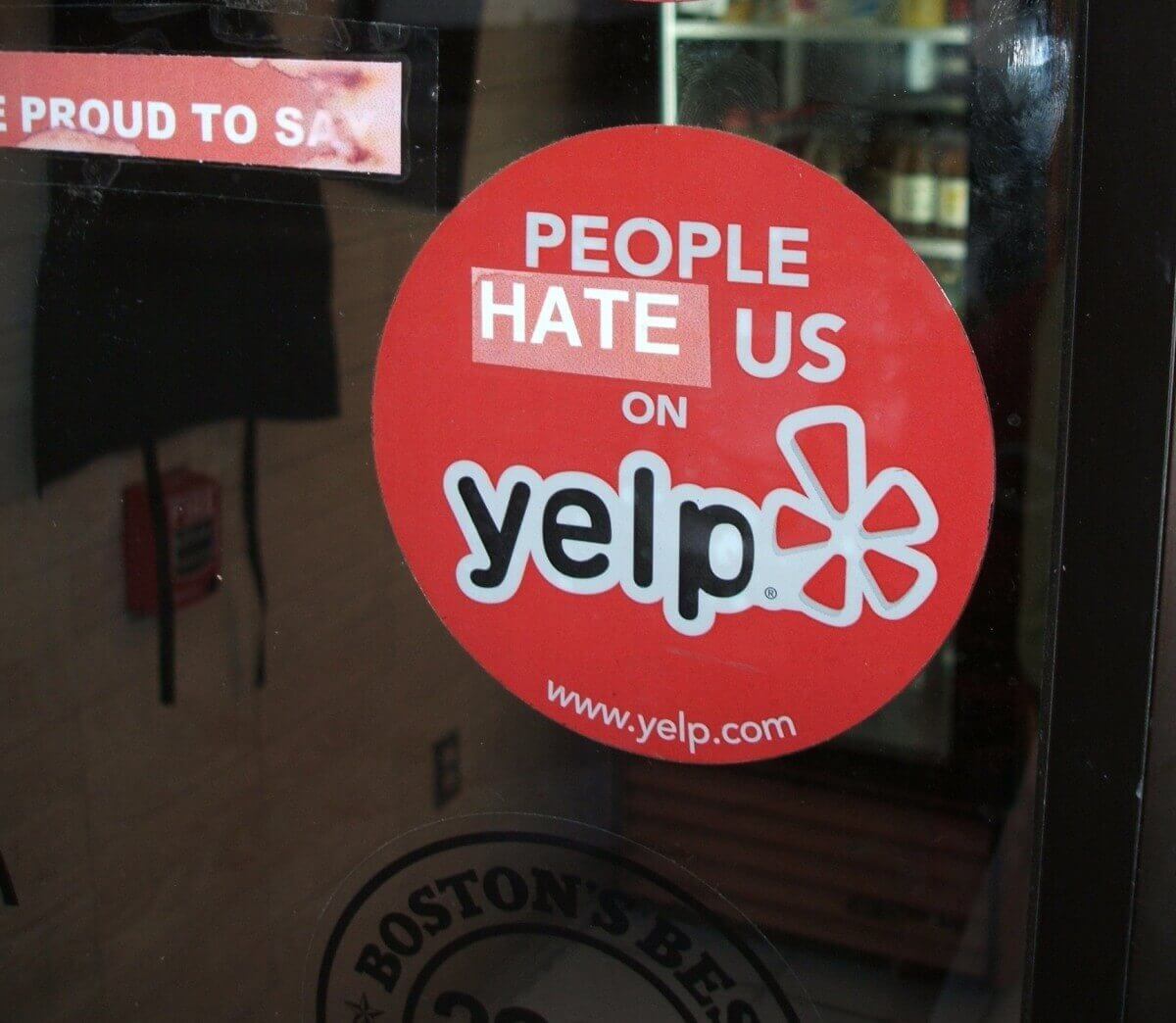 "People hate us on Yelp" sticker on Boston Store door