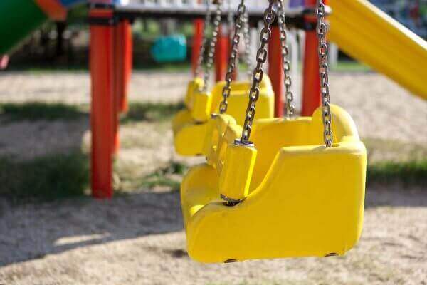 Yellow children's swing on a playground